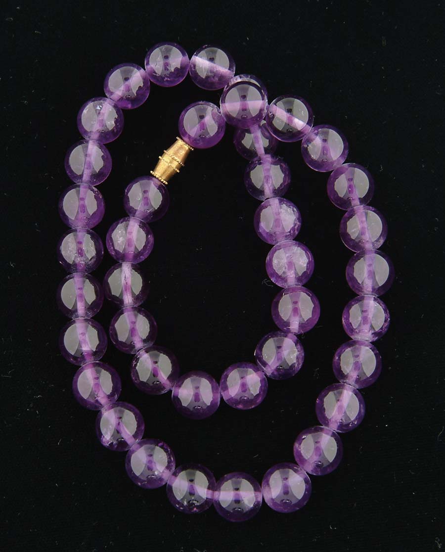 Appraisal: AMETHYST BEAD NECKLACE Forty mm amethyst beads with a barrel