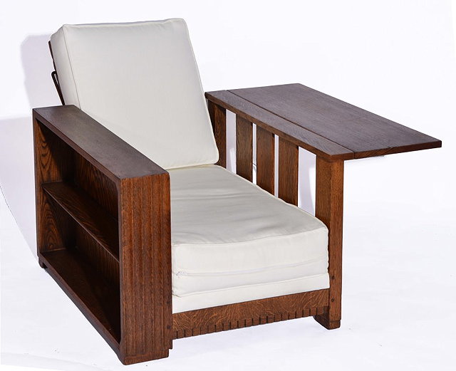 Appraisal: A HEALS OAK RECLINING BOOKSHELF CHAIR with fold out side