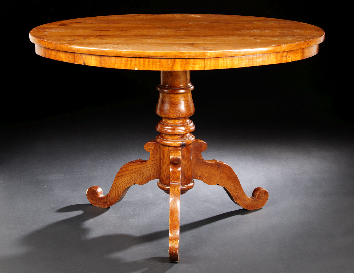 Appraisal: Victorian-Style Elm Breakfast Table the oval top on a tripodal