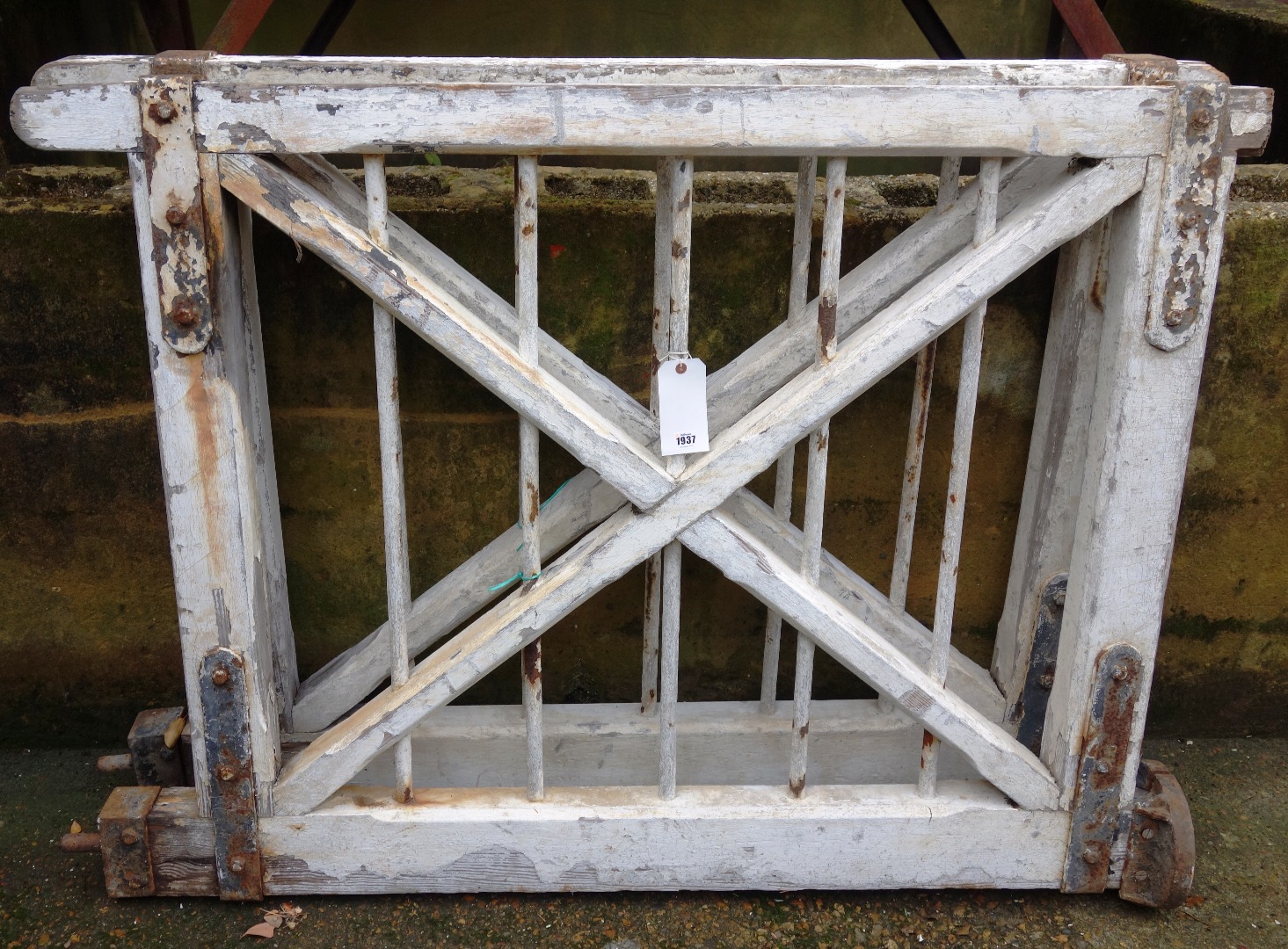 Appraisal: A pair of white painted iron and wood railway gates