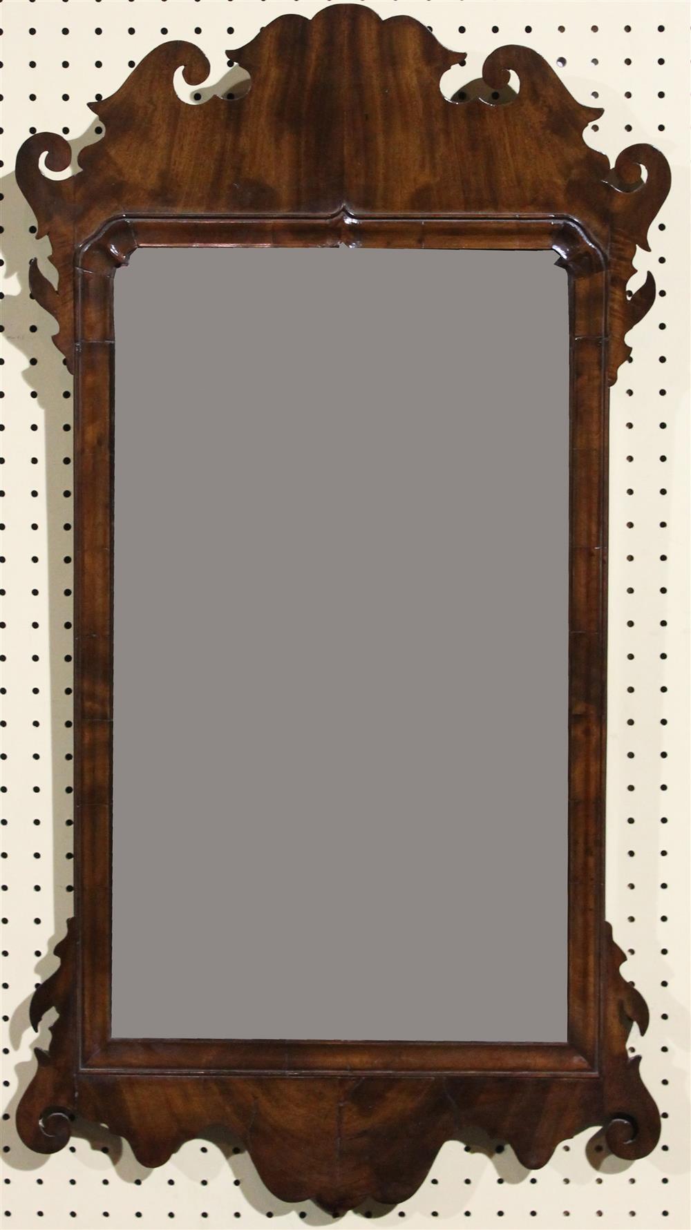 Appraisal: TH C ENGLISH MAHOGANY SCROLL CUT FRAME AND MIRROR having