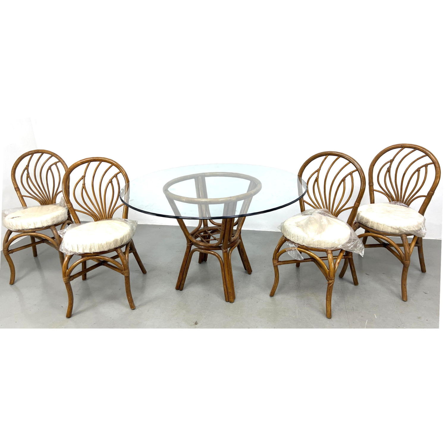 Appraisal: Royal Design Rattan Dining Set Table and Chairs Dimensions H