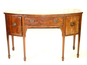 Appraisal: A mahogany bow front sideboard th century with central frieze