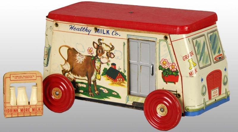 Appraisal: Tin Litho Gong Bell Healthy Milk Truck Toy Description Wooden