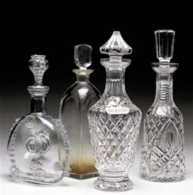 Appraisal: FOUR DECANTERS Four European crystal and glass decanters Orrefors square