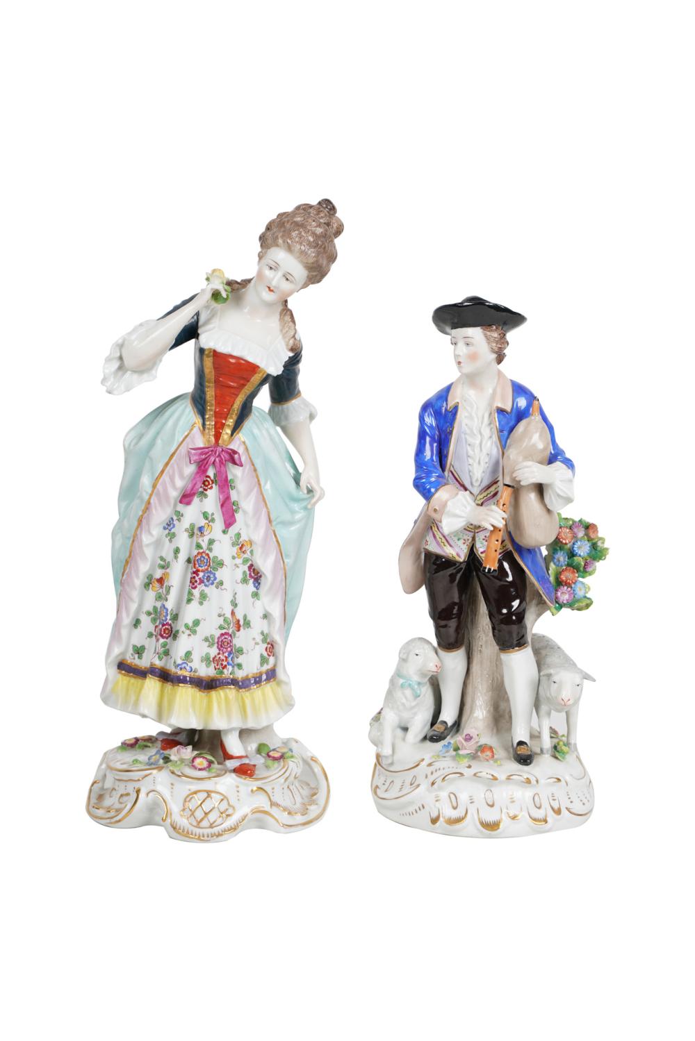 Appraisal: TWO CONTINENTAL PORCELAIN FIGURINESthe female figure marked Royal Vienna the