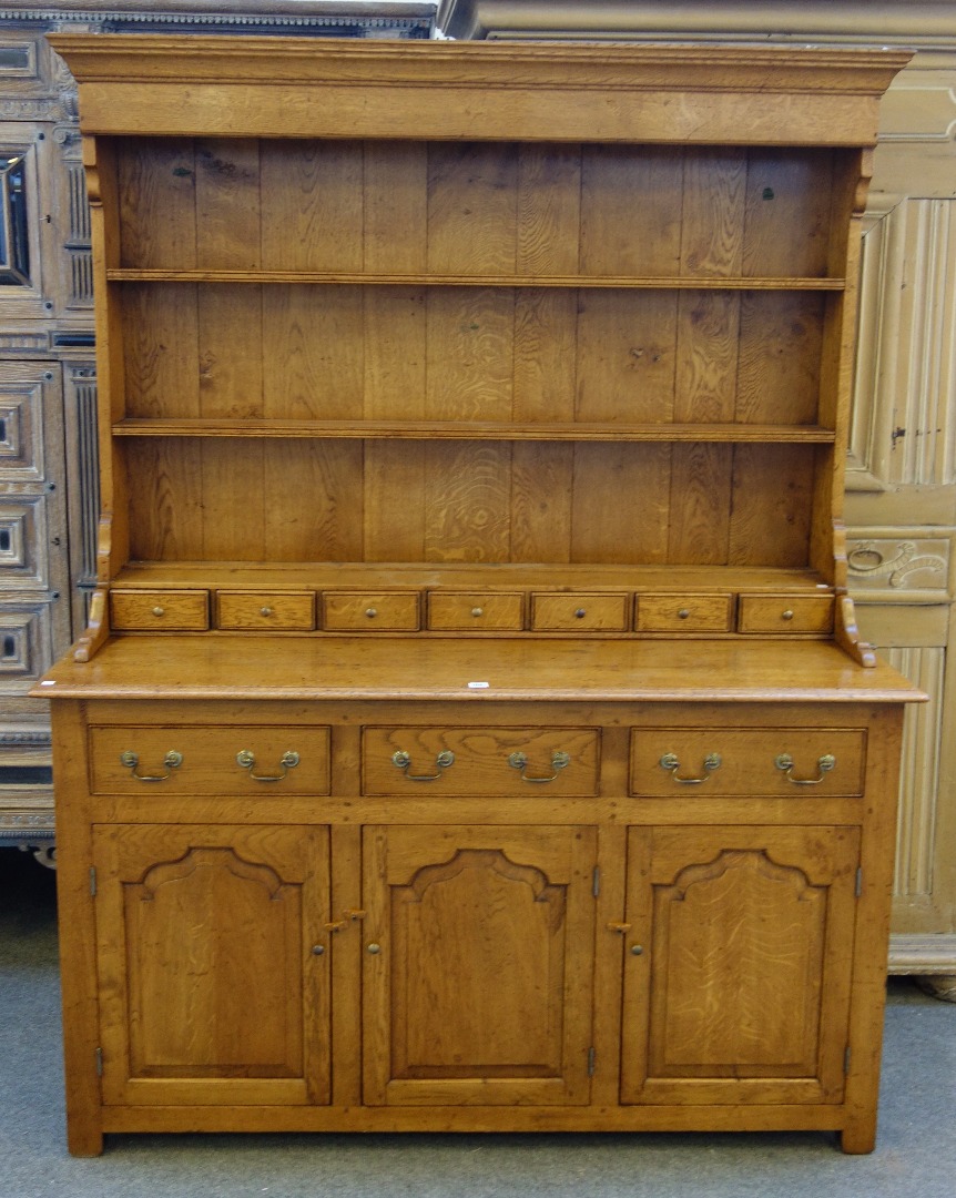 Appraisal: An th century style oak dresser the enclosed three tier