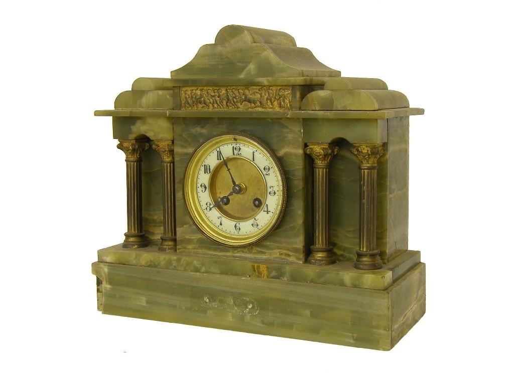 Appraisal: French green onyx two train mantel clock the Marque movement