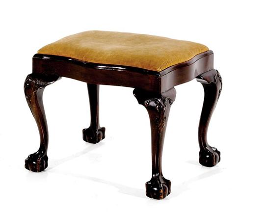 Appraisal: Georgian style carved mahogany footstool late th century serpentine slip