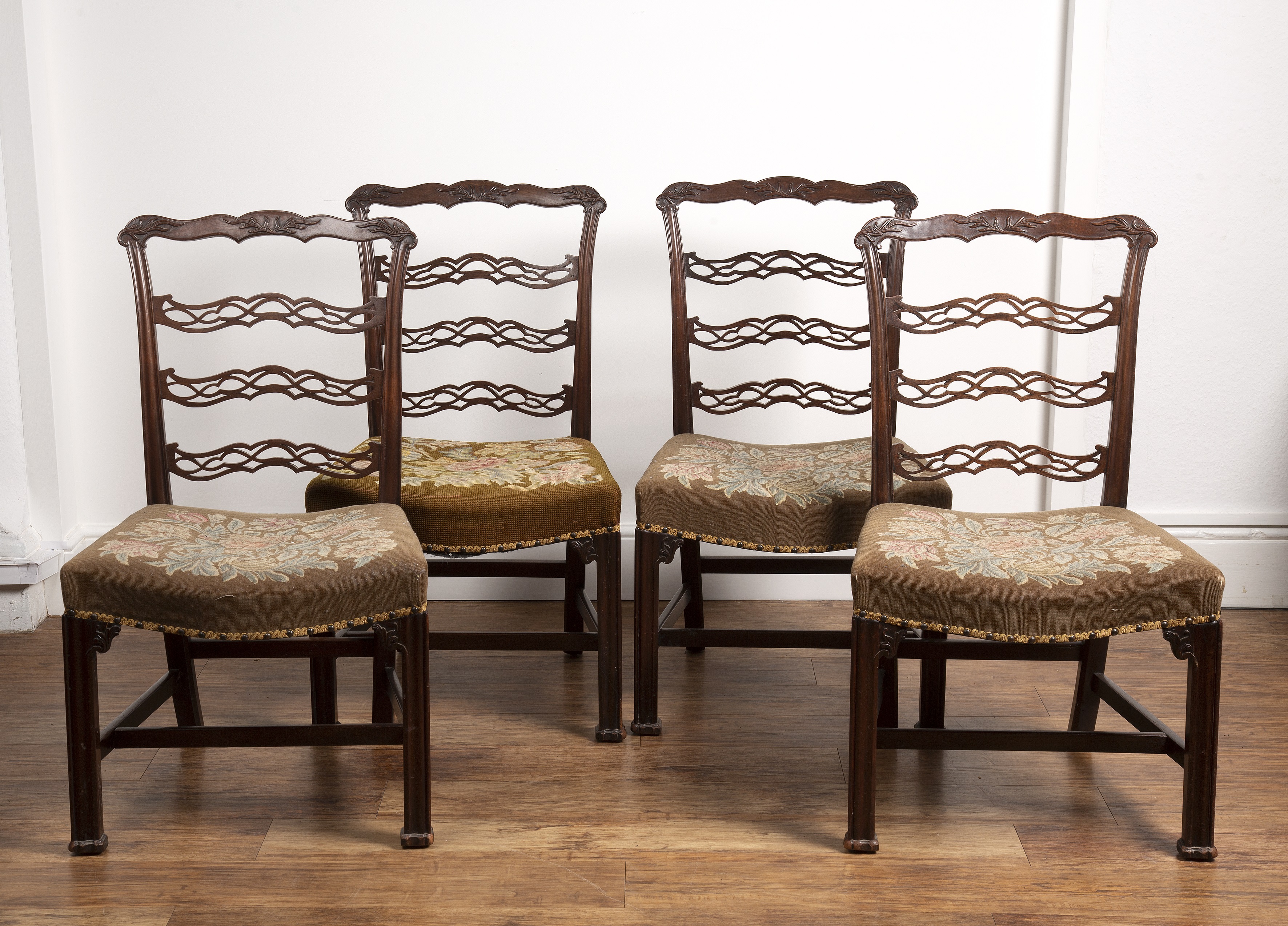 Appraisal: Set of four Chippendale style ladderback dining chairs th th