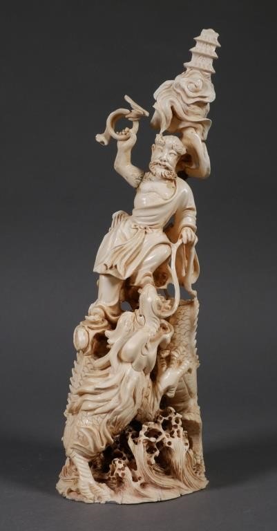 Appraisal: Nicely carved elephant ivory depiction of a man standing over