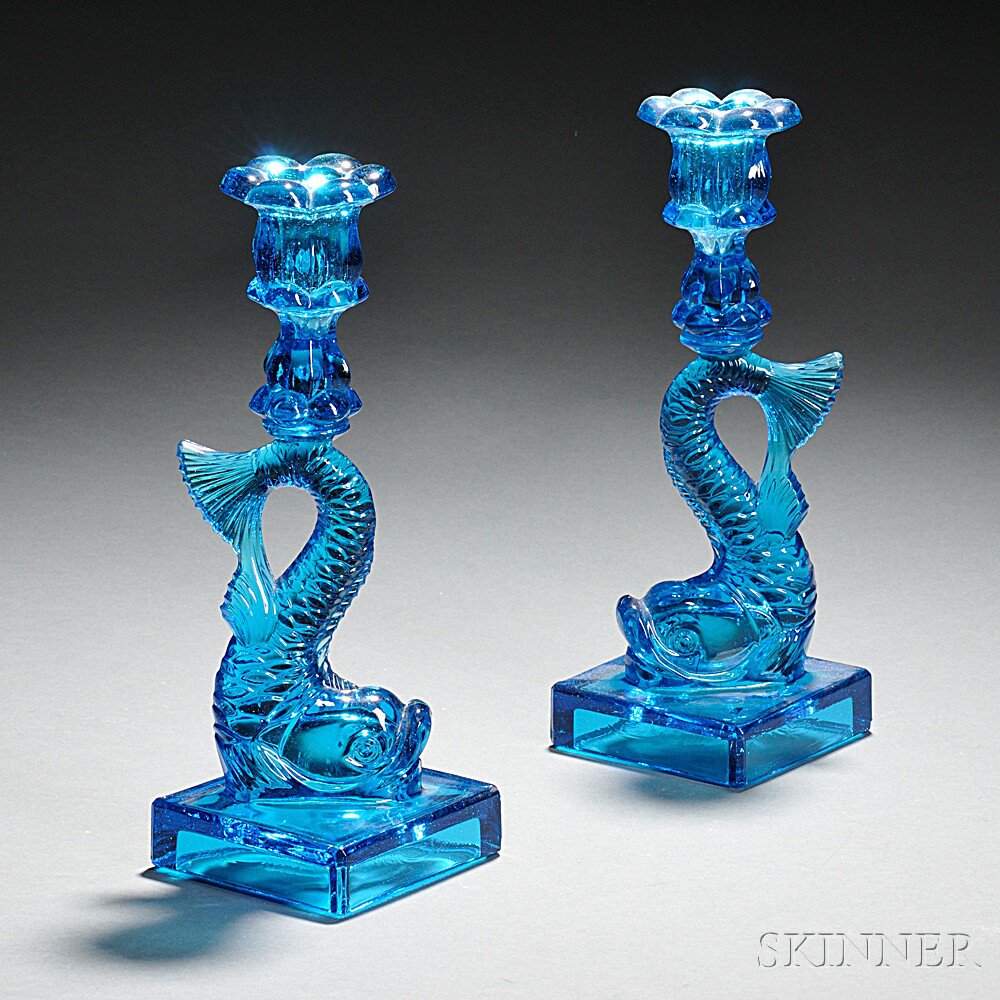 Appraisal: Pair of Blue Pressed Glass Dolphin Candlesticks Sandwich Massachusetts mid