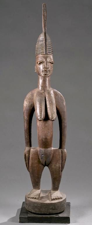 Appraisal: Yoruba standing female shrine figure early th c A standing