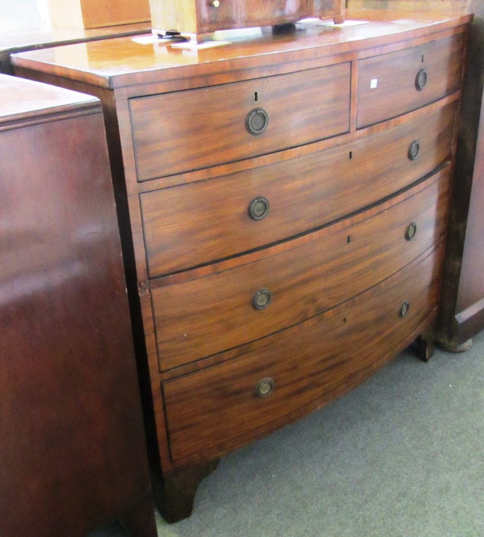 Appraisal: A Regency mahogany bowfront chest of two short and three