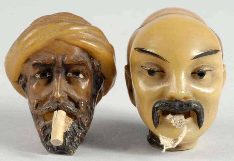 Appraisal: Lot of Male Head Figural Tape Measures Description Thick celluloid