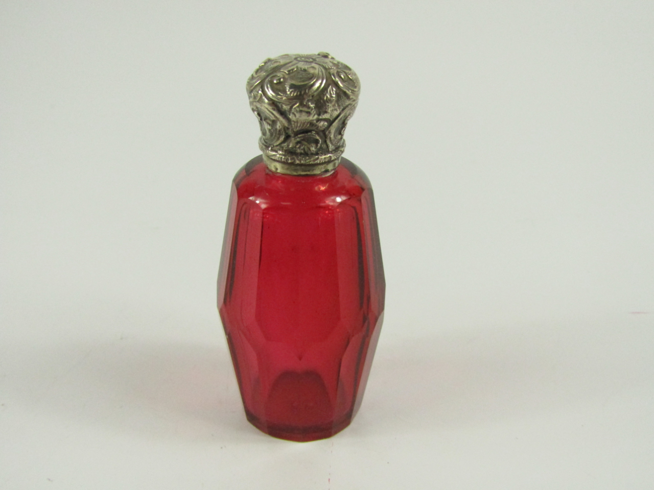 Appraisal: A Victorian slice cut cranberry glass scent bottle with white