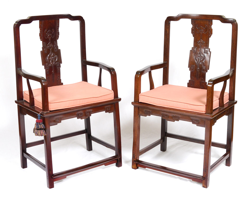 Appraisal: CARVED CHINESE ARM CHAIRS Shaped top rails with carved back