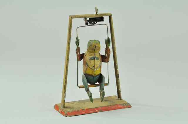 Appraisal: FROG ON SWING Gunthermann Germany hand painted wears full painted