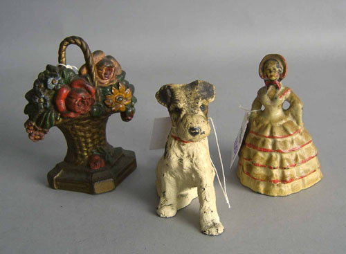 Appraisal: Three cast iron doorstops in the form of a dog