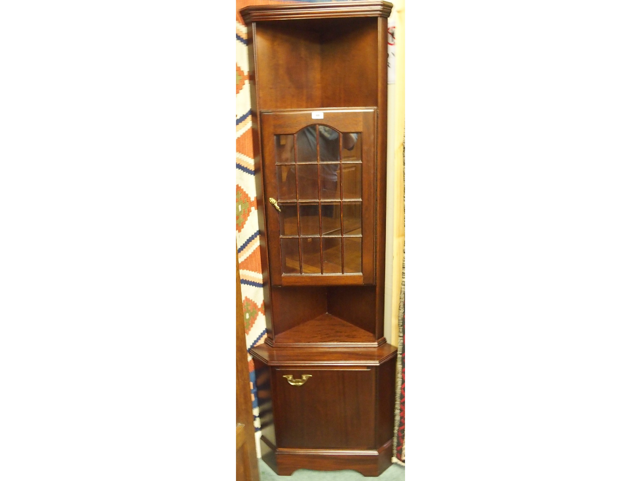 Appraisal: A contemporary mahogany corner cabinet