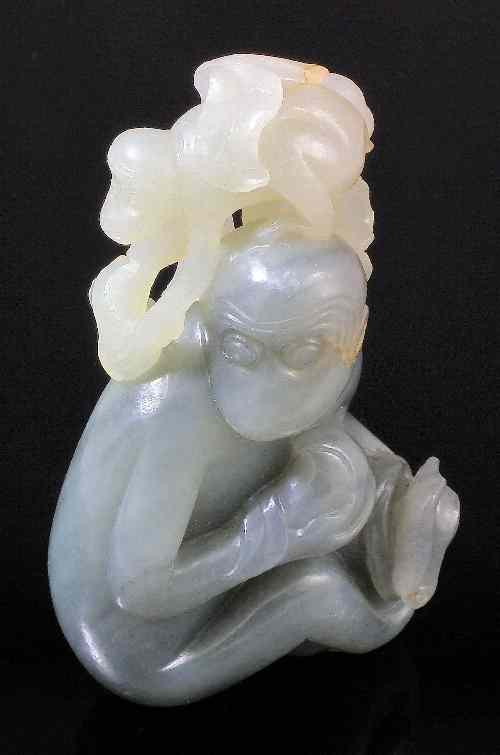 Appraisal: A Chinese grey and celadon jade carving of a monkey