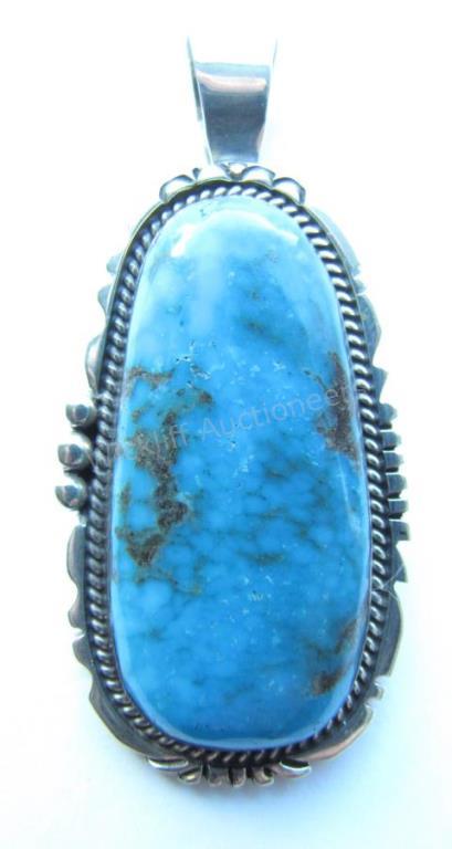 Appraisal: A sterling silver blue diamond turquoise pendant attributed to Auggie