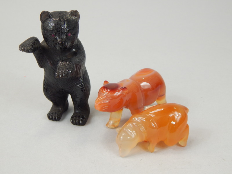 Appraisal: Three carved hardstone bears comprising black bear with red eyes