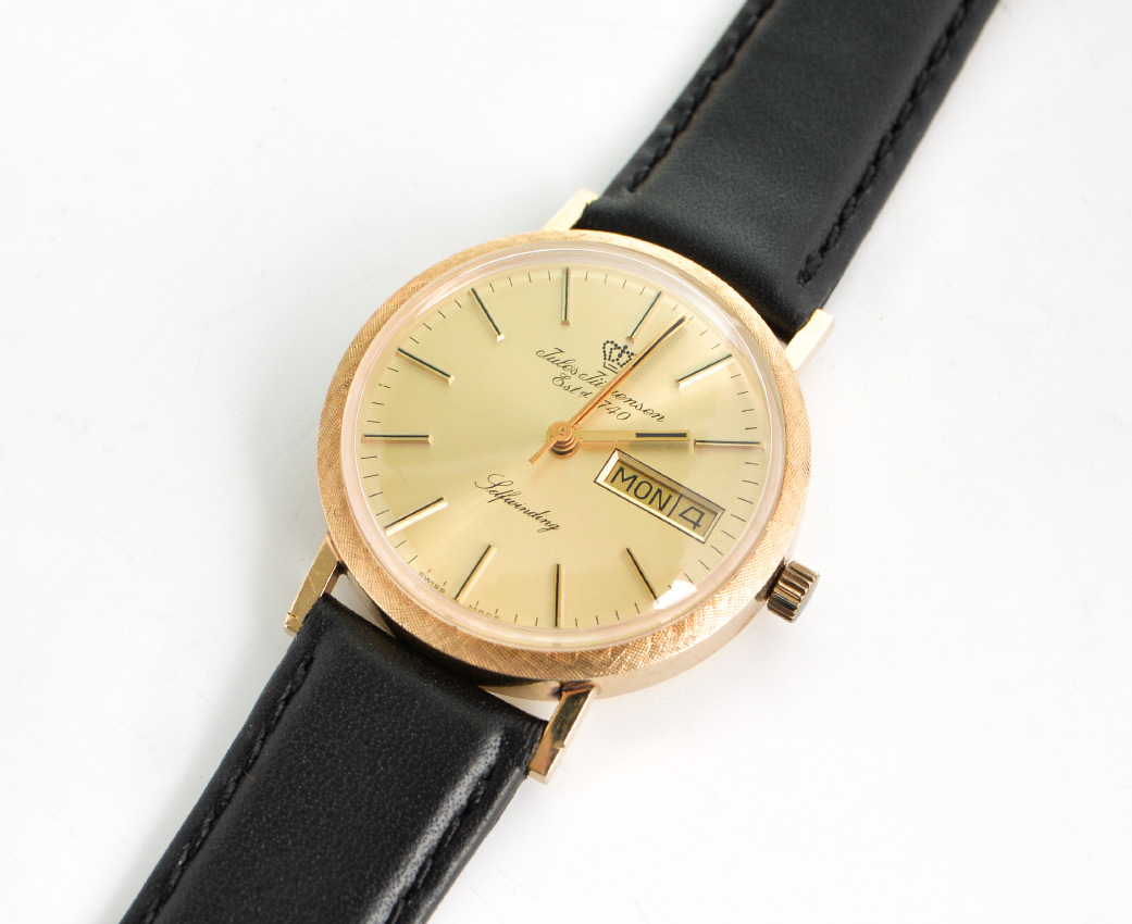 Appraisal: VINTAGE JULES JURGENSEN K GOLD WATCH W DAY DATE Stuller