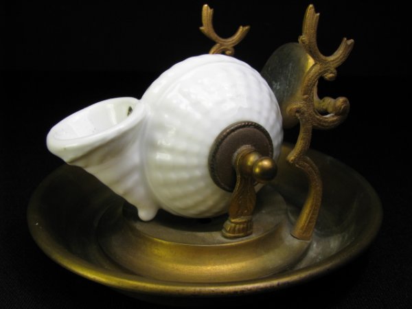 Appraisal: Very unusual Victorian porcelain conk shell inkwell mounted on a