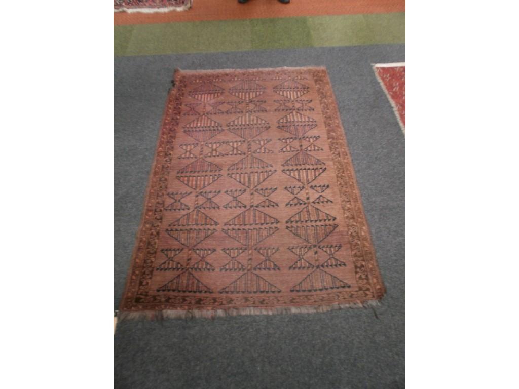 Appraisal: A red ground bokhara rug cm x cm