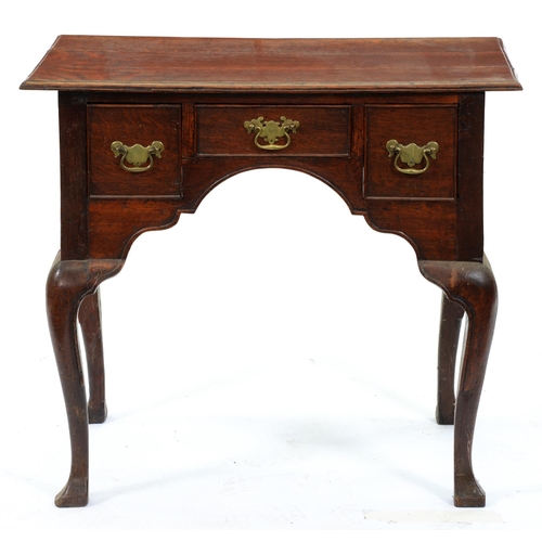 Appraisal: An oak lowboy th c with three cockbeaded drawers about