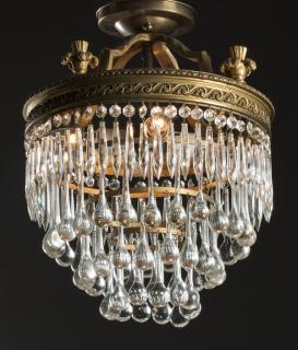 Appraisal: Hollywood Regency style four-tier crystal chandelier the gilte metal canopy