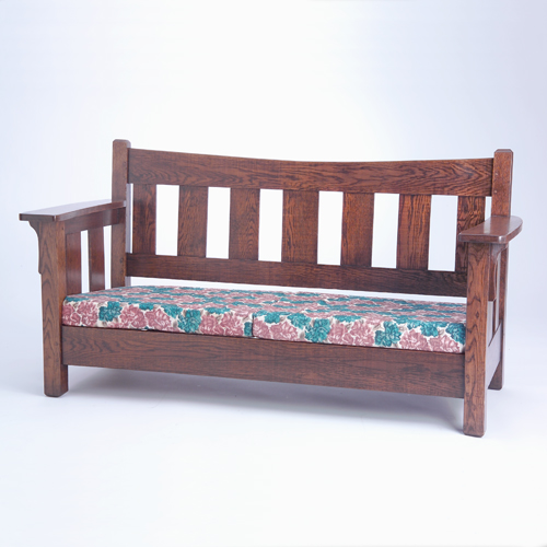 Appraisal: Arts and Crafts mission settee with curved crest rail over