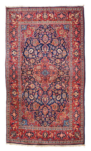 Appraisal: A PERSIAN KASHAN BLUE GROUND RUG with a central red