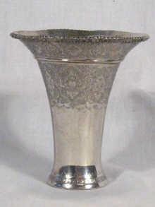 Appraisal: A Persian silver trumpet shaped beaker with engraved decoration circa