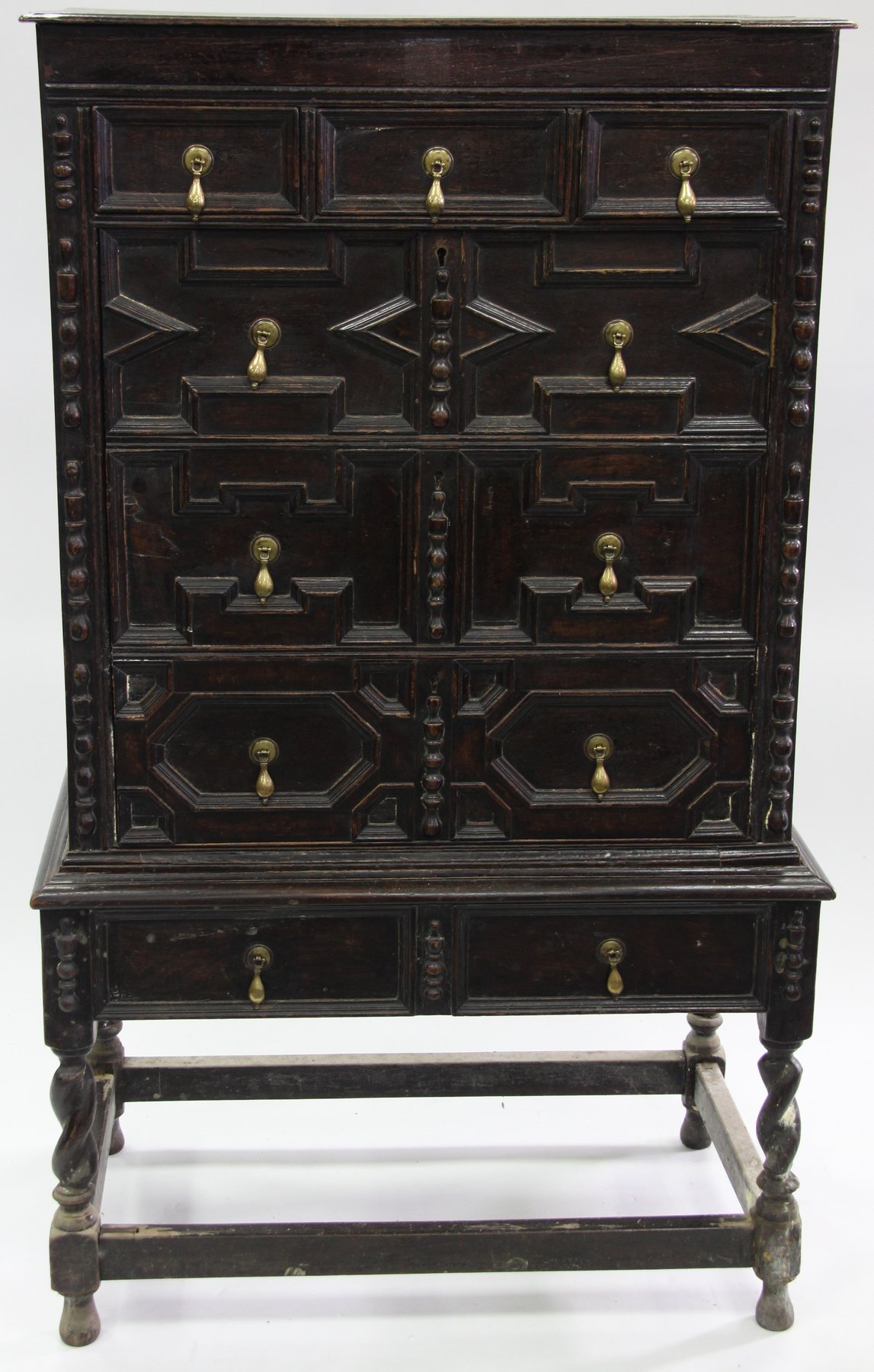 Appraisal: A Jacobean style oak chest on stand cm wide