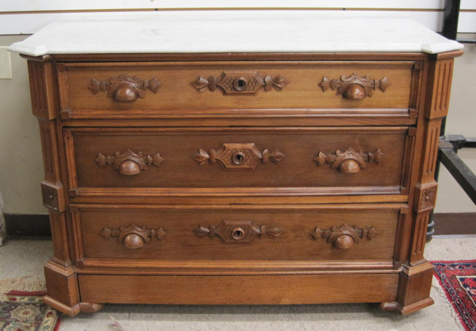 Appraisal: VICTORIAN WALNUT DRESSER American c the three-drawer chest having a