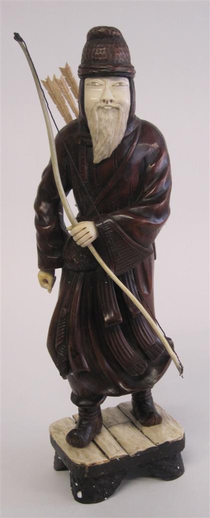 Appraisal: Tall Japanese pieced ivory and hardwood archer figureTall standing figure