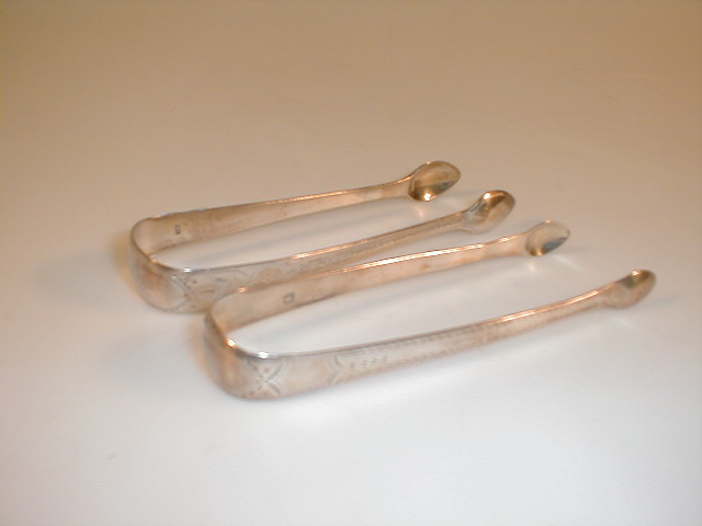 Appraisal: Two pairs of Georgian bright cut silver sugar tongs