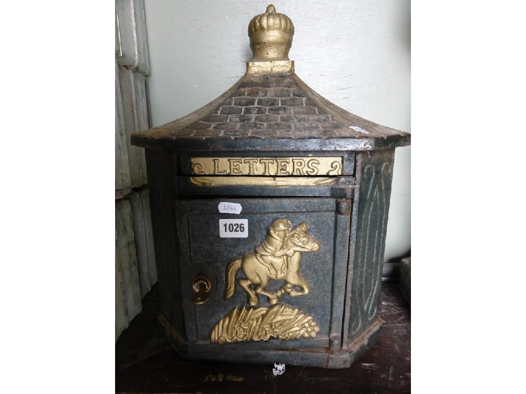 Appraisal: A reproduction cast iron wall mounted post box enclosed by