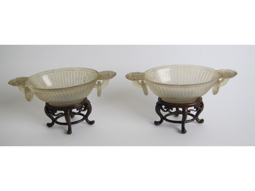 Appraisal: A pair of Chinese agate two handled libation cups the