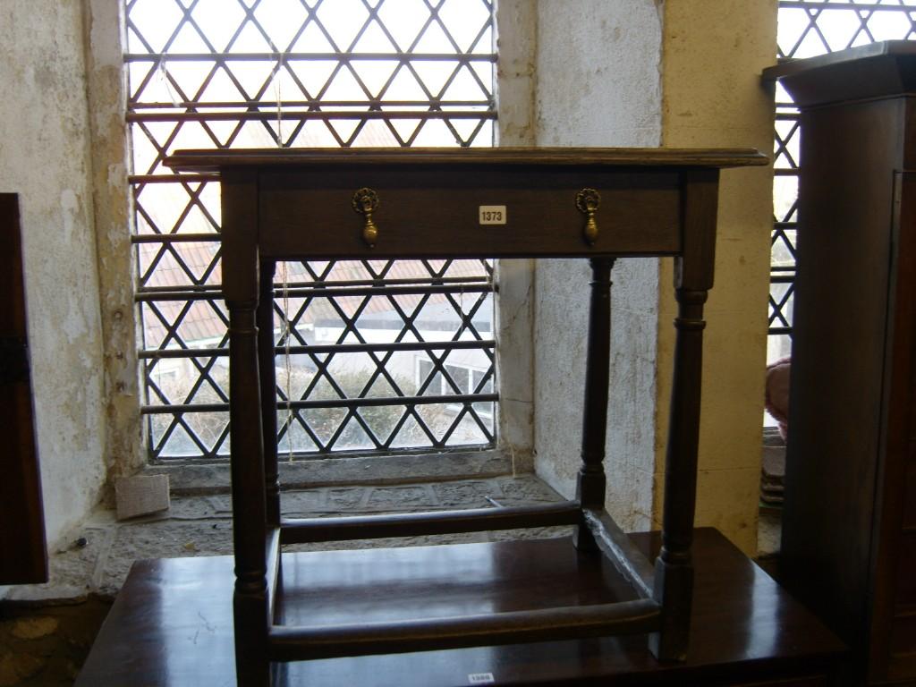 Appraisal: A Georgian oak side table fitted with a single frieze