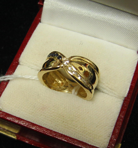 Appraisal: DIAMOND SAPPHIRE AND FOURTEEN KARAT GOLD RING set with seven