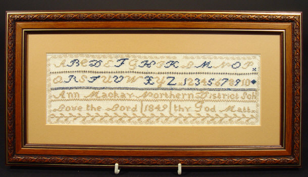 Appraisal: Victorian sampler embroidered with the alphabet and script by Ann