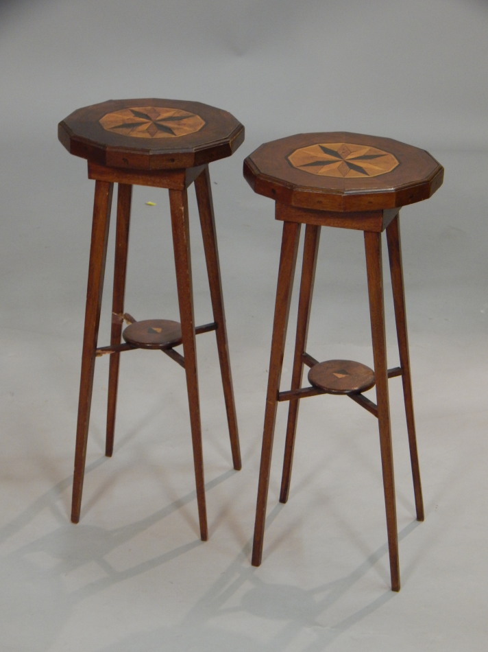 Appraisal: A pair of thC mahogany urn stands each with a