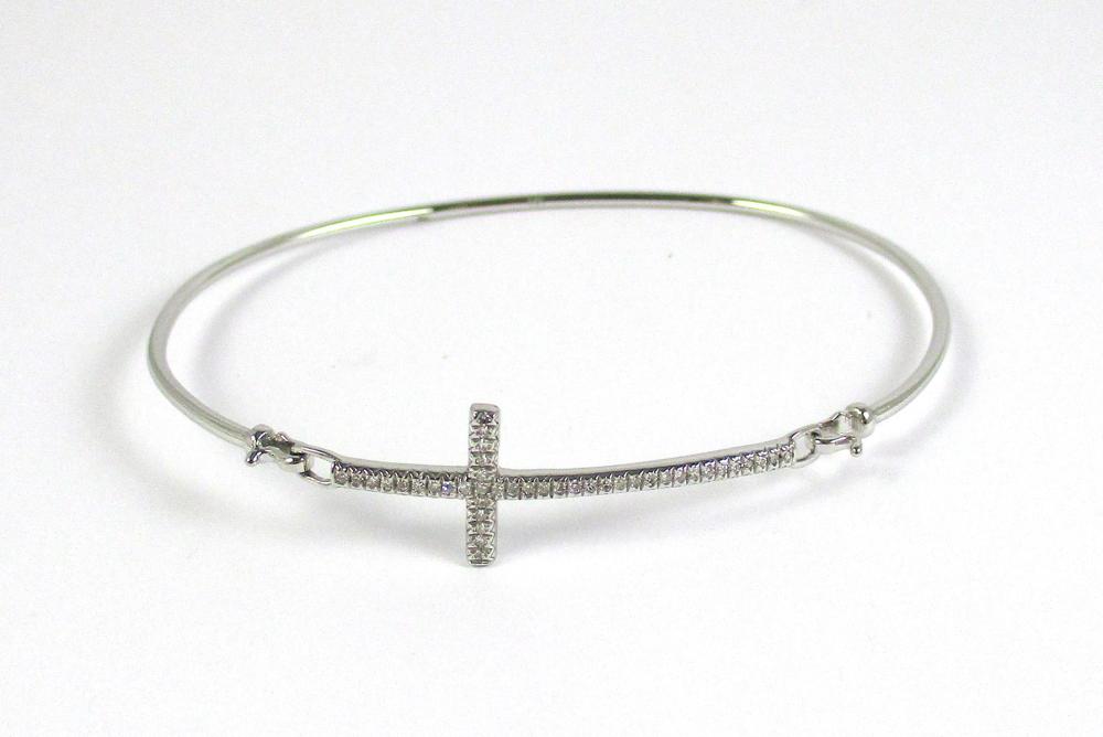 Appraisal: DIAMOND AND FOURTEEN KARAT WHITE GOLD BANGLE featuring round-cut diamonds