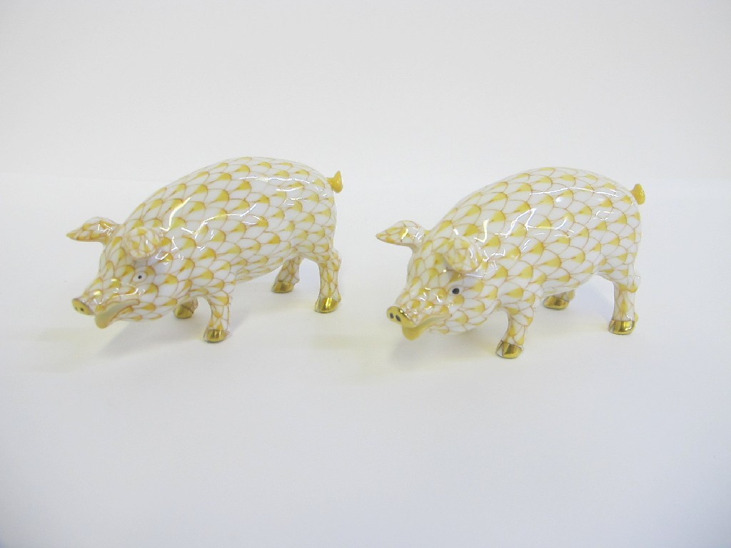 Appraisal: Pair of Herend pigs with yellow scale decoration