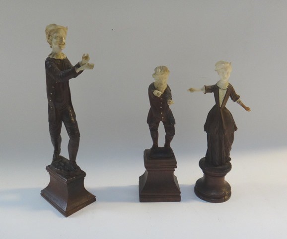 Appraisal: Three Black Forest carved wooden figures circa each with carved