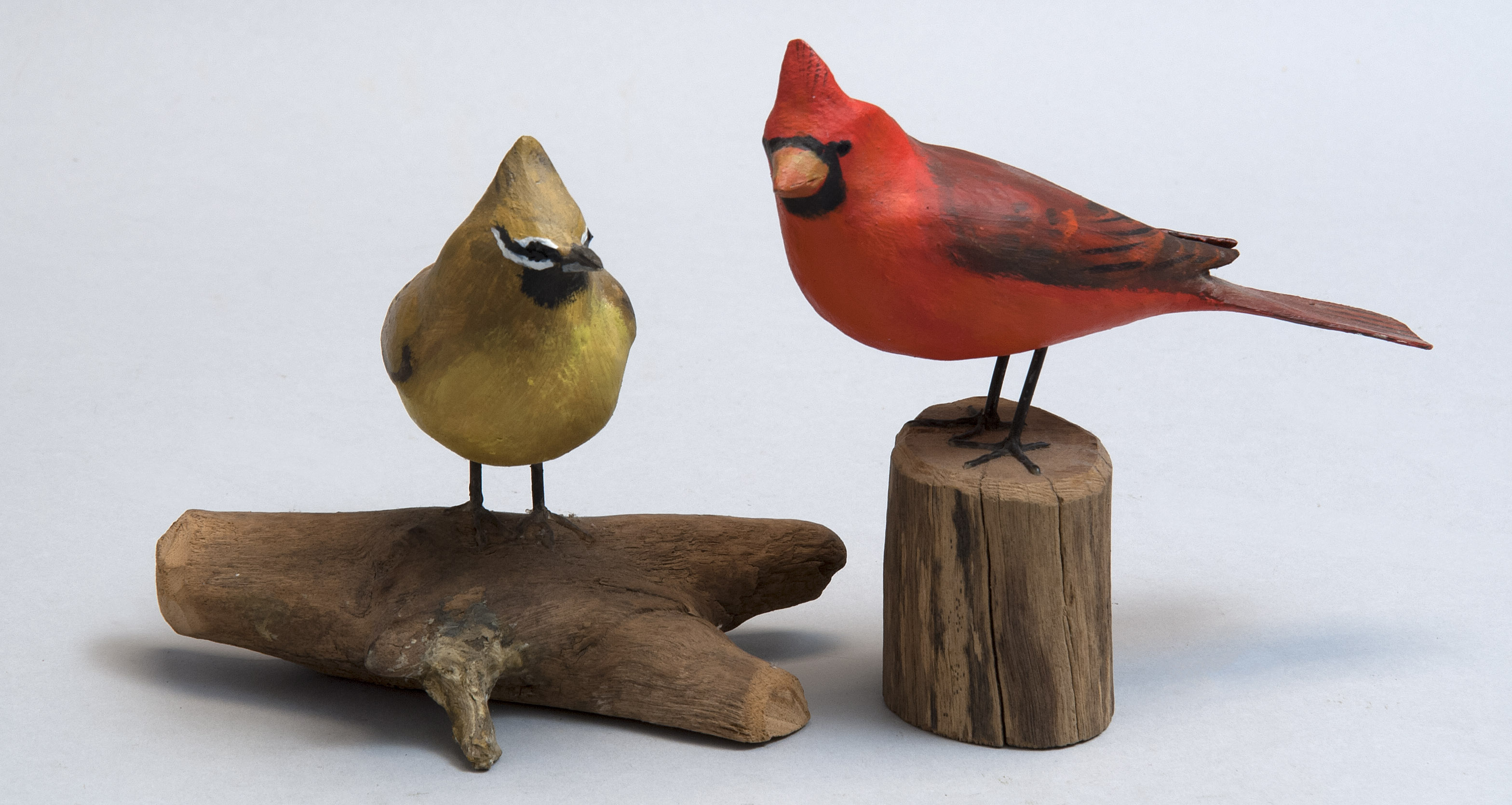 Appraisal: TWO LIFE-SIZE CARVINGS OF SONGBIRDS th CenturyBy Peter Peltz of