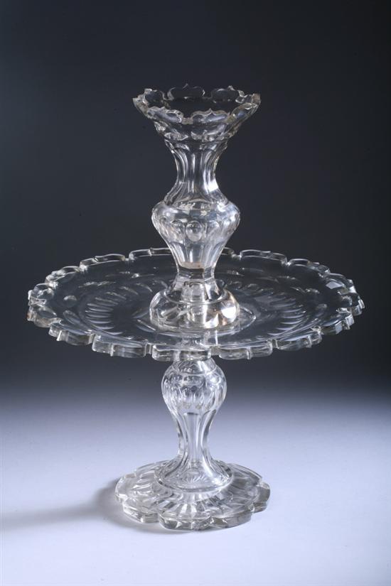 Appraisal: CUT-GLASS CENTERPIECE th century probably English Scalloped base baluster-form shaft